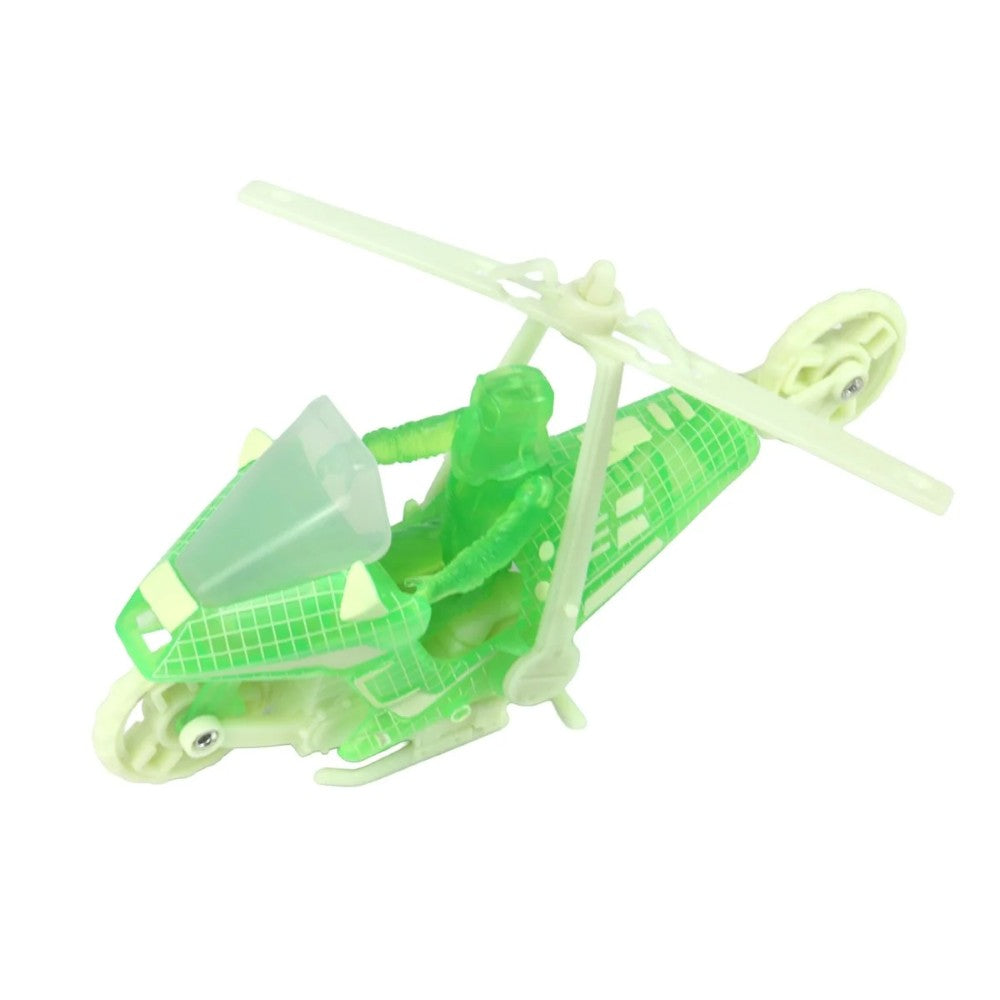 Translucent green toy helicopter with a seated figure and large overhead rotor