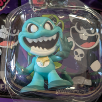 Go Figment Nightmare Critters Series 4 turquoise mini figure with wide grin and raised hand in clear packaging