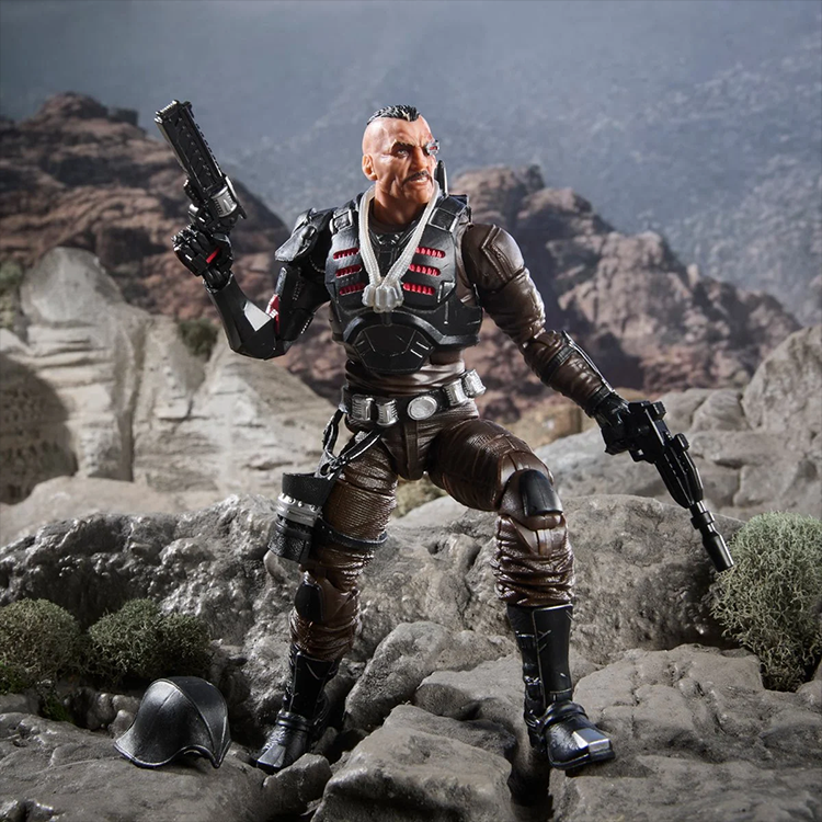Major Bludd 6-inch action figure by Hasbro posed on rocky terrain with weapons and accessories in combat stance