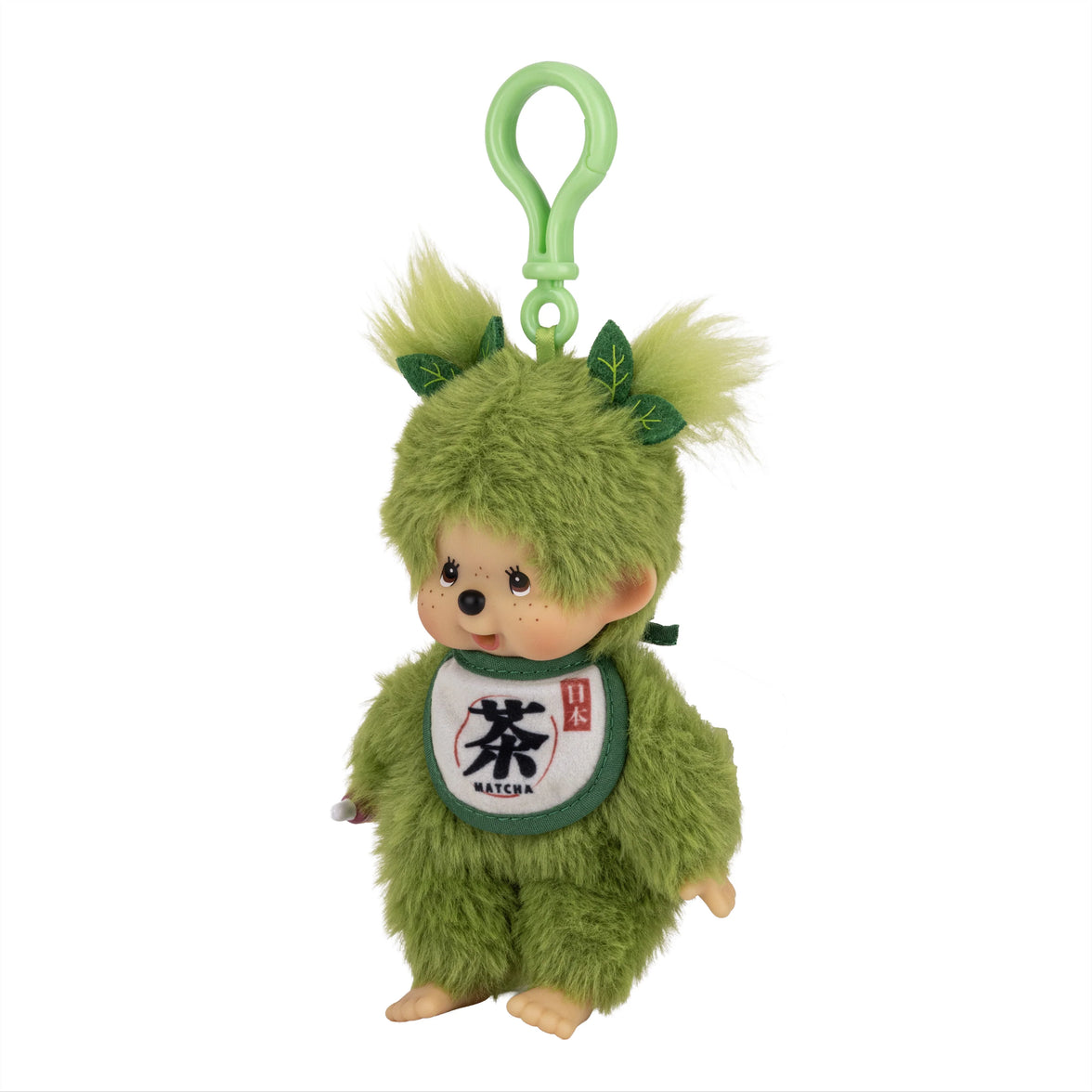Green plush character keychain with leaf accents and a matcha bib against a white background