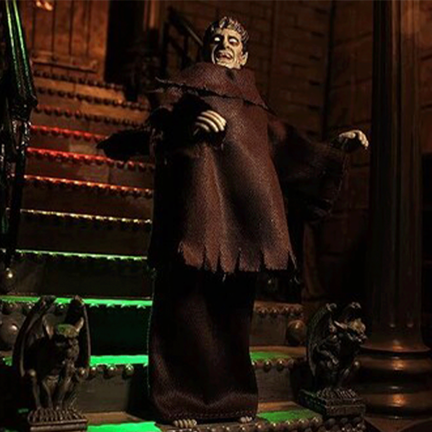Mego 8-inch vintage horror figure draped in tattered brown robe posed on gothic staircase with gargoyle statues