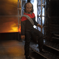 Lt. Worf Star Trek TNGRetro Style Articulated Mego Action Figure 8 inch posed on industrial sci-fi set by Mego
