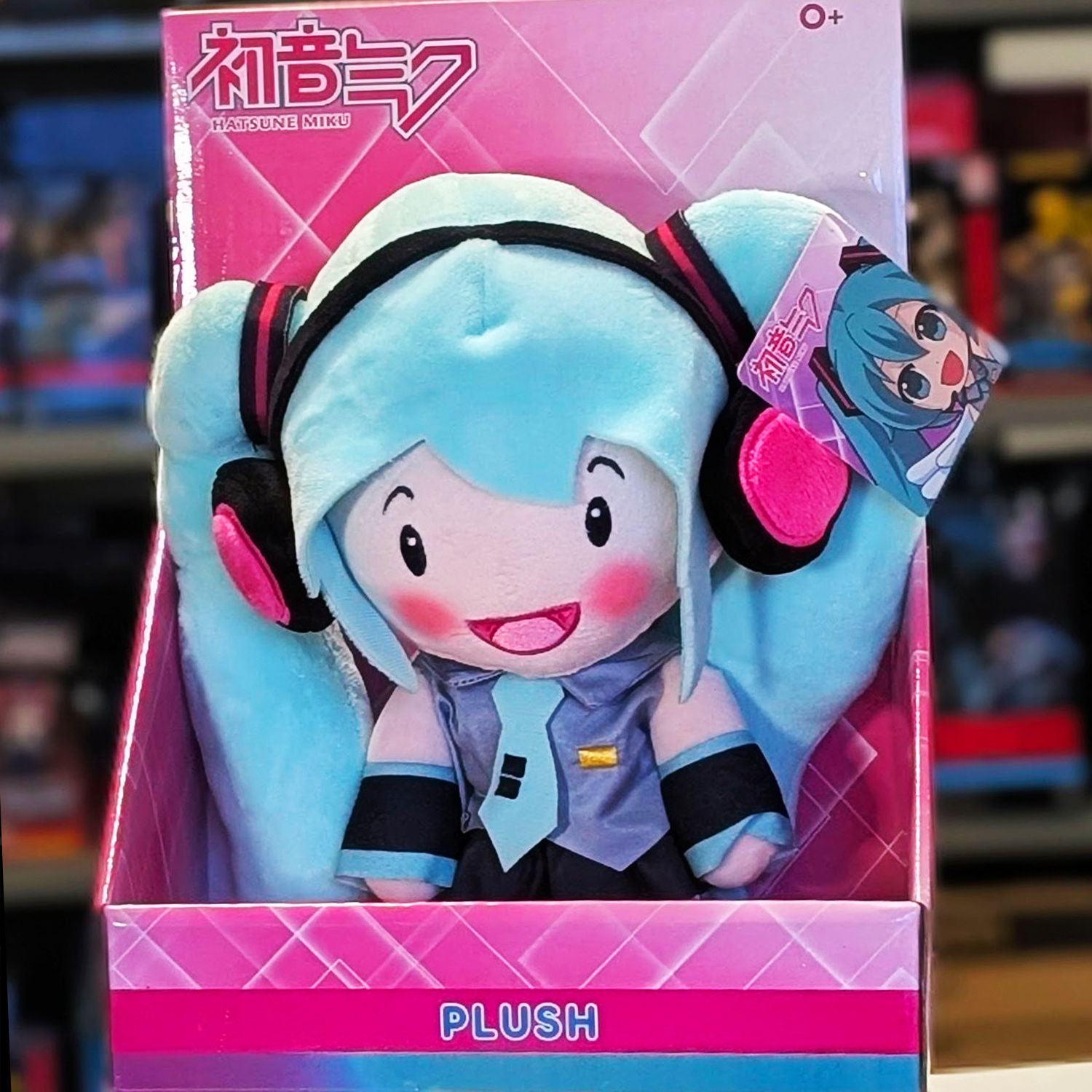 12-inch Hatsune Miku plush with blue hair and pink headphones in UCC branded pink platform box