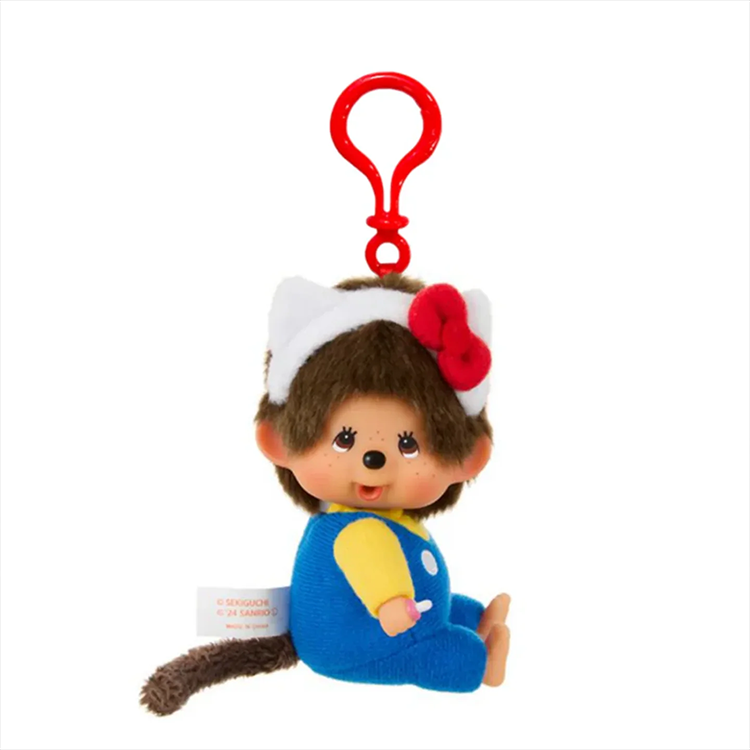 Sekiguchi Monchhichi plush clip wearing Hello Kitty ears and bow with blue overalls and red clip attachment