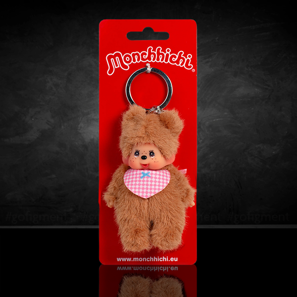 Sekiguchi Monchhichi 4-inch plush keychain in bear costume with pink checkered bib on red backing card