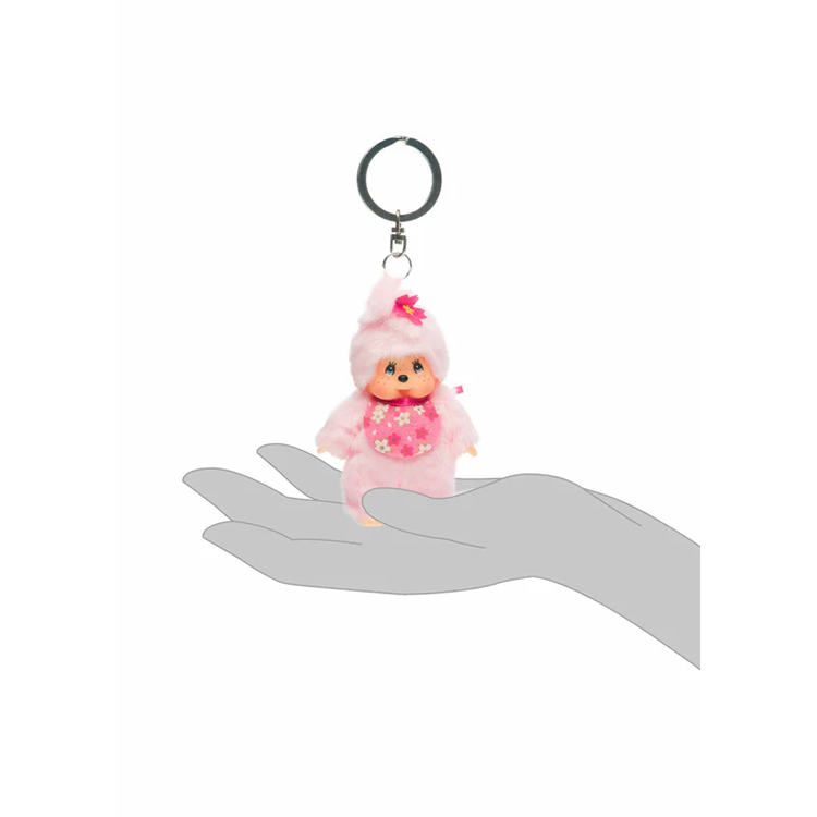 Sekiguchi Monchhichi 4 inch plush keychain with cherry blossom design held in hand for size reference