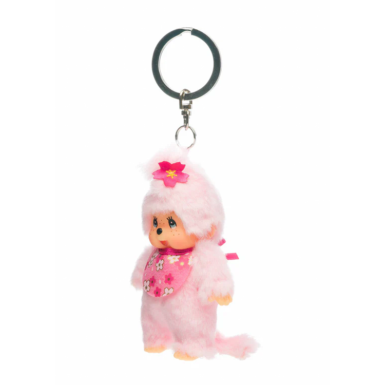 Sekiguchi Monchhichi plush keychain in pink cherry blossom design with bib and flower detail, 4 inches tall.