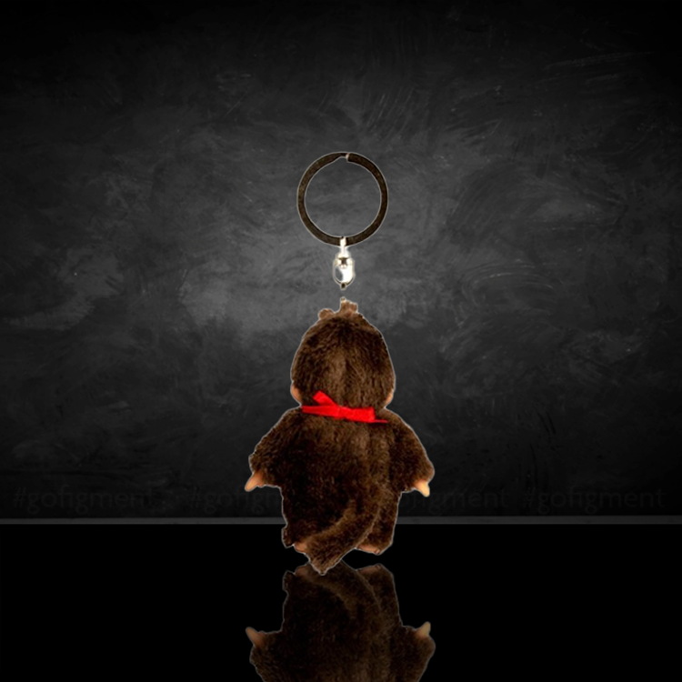 Sekiguchi Monchhichi Classic Girl plush keychain with red bib and bow, soft and collectible 4-inch charm.