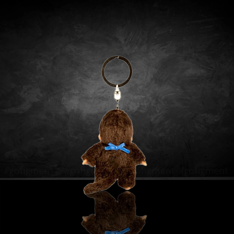 Sekiguchi Monchhichi Classic Boy plush keychain with blue bib, soft collectible toy for on-the-go nostalgia.