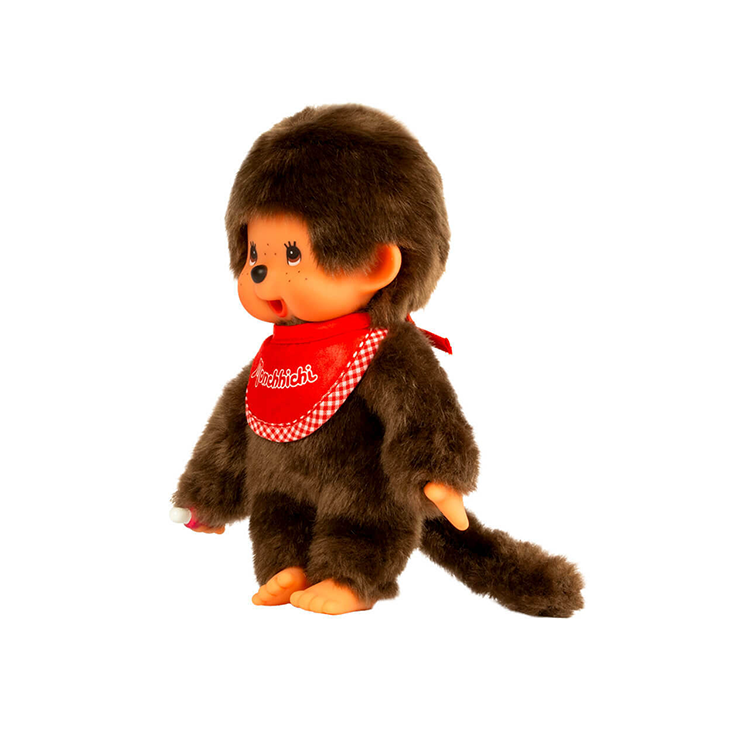 Sekiguchi Monchhichi 8-inch plush toy with red bib, thumb-sucking pose, soft fur, and detailed face.