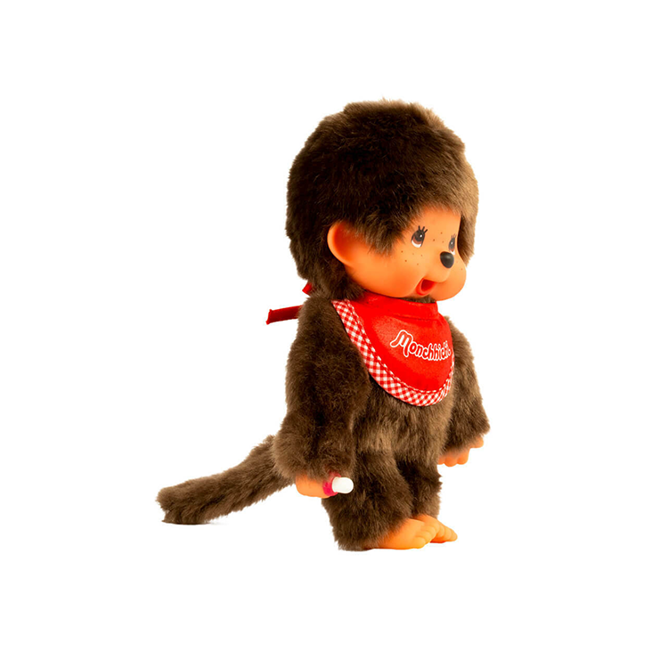 Sekiguchi Monchhichi Classic 8-inch plush boy monkey with red bib and thumb in mouth side view on white background