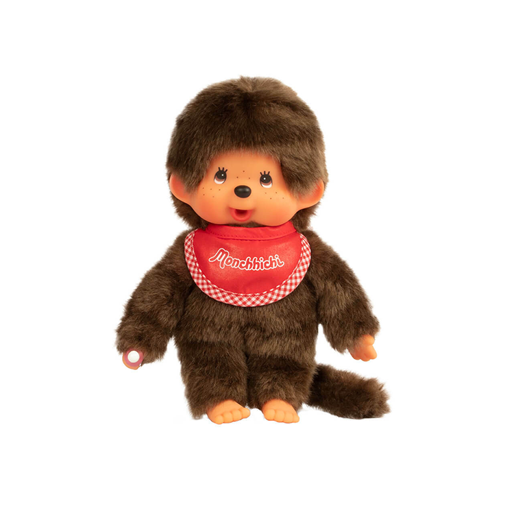 Sekiguchi Monchhichi 8-inch plush monkey wearing red bib with thumb in mouth and soft brown fur.