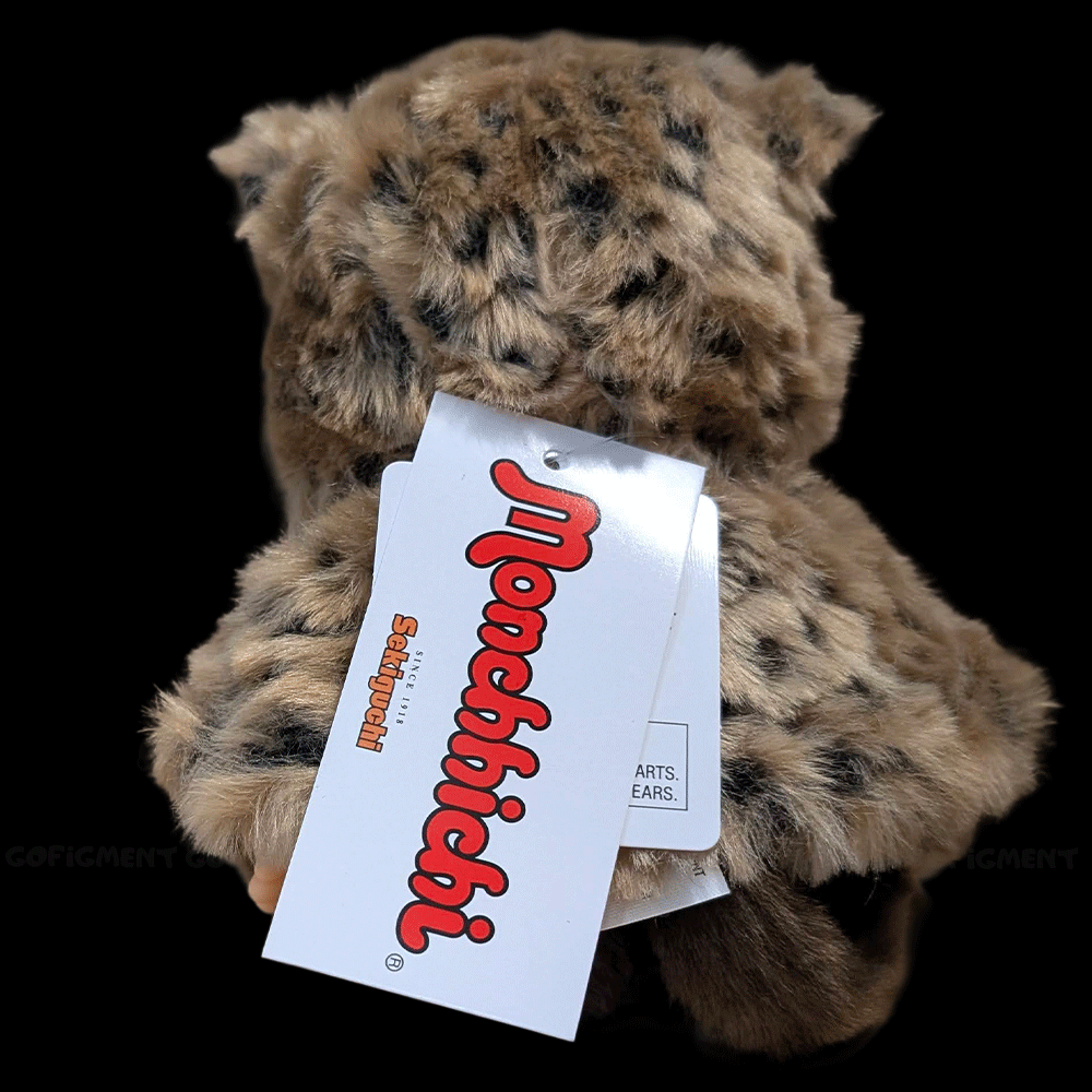 Sekiguchi Monchhichi 8-inch plush monkey wearing leopard hood and cape with attached brand tags back view