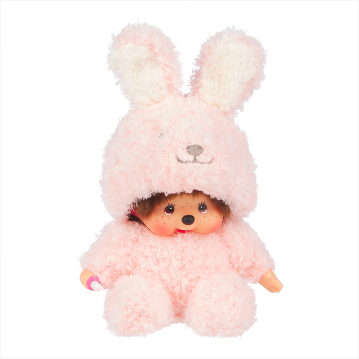 Sekiguchi Monchhichi plush doll dressed in a soft pink fluffy bunny costume sitting with thumb in mouth.