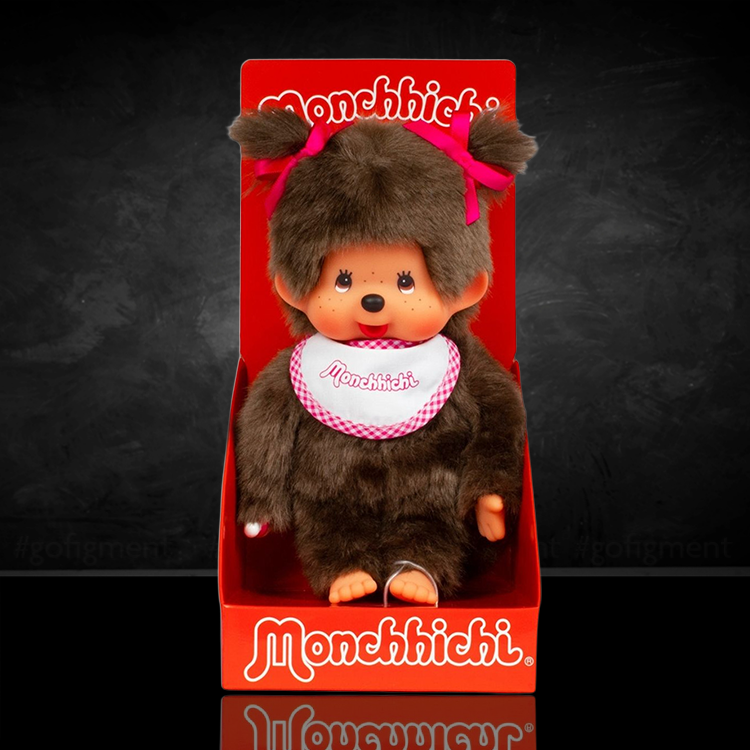 Sekiguchi Monchhichi classic 7-inch plush girl monkey wearing white and pink bib with bows in hair