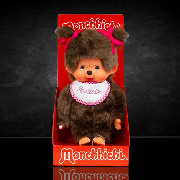 Sekiguchi Monchhichi classic 7-inch plush girl monkey wearing white and pink bib with bows in hair