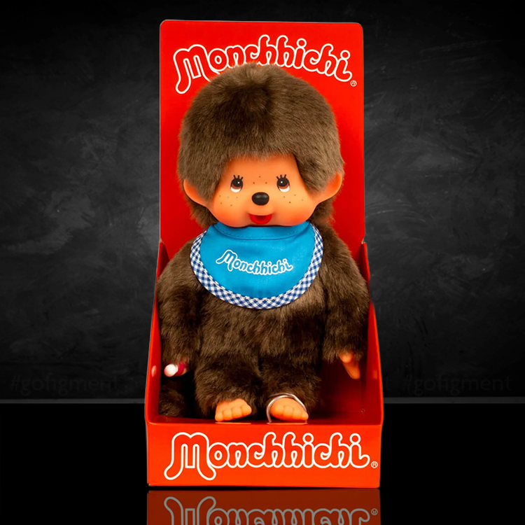 Sekiguchi Monchhichi Classic 8-inch plush monkey with blue bib in original red packaging display.