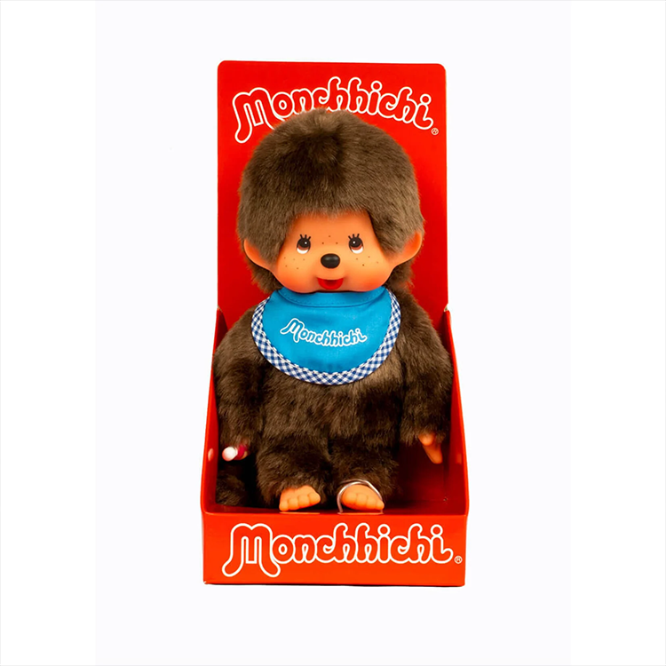 Sekiguchi Monchhichi classic 8-inch plush toy with blue bib in bright red branded display box.