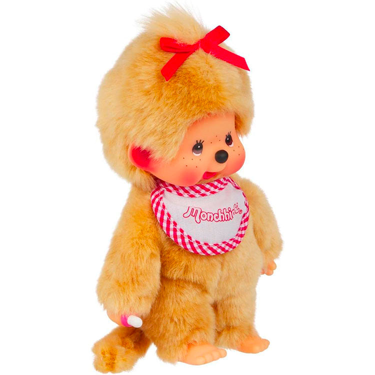 Sekiguchi Monchhichi Girl plush with beige fur, red bow, red gingham bib, and thumb-sucking pose, 8 inches tall.