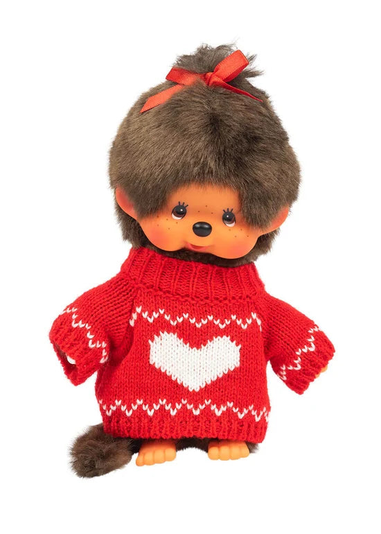 Brown-haired doll with a red bow and red sweater featuring a white heart pattern