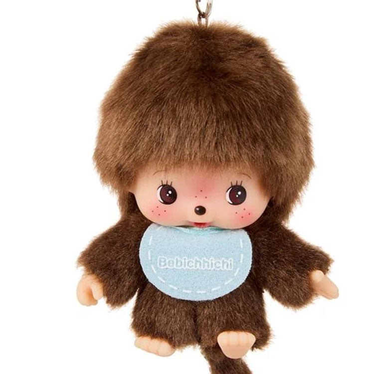 Sekiguchi Monchhichi Bebichhichi plush keychain with oversized head wearing blue bib and brown fur mascot design