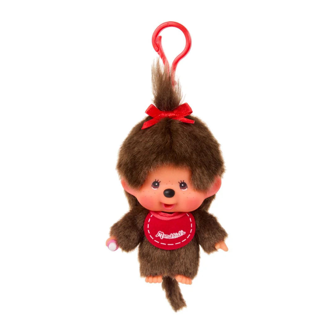 Sekiguchi Monchhichi Girl plush keychain with red bow, pink bib, soft fur, and clip for bags or keys.