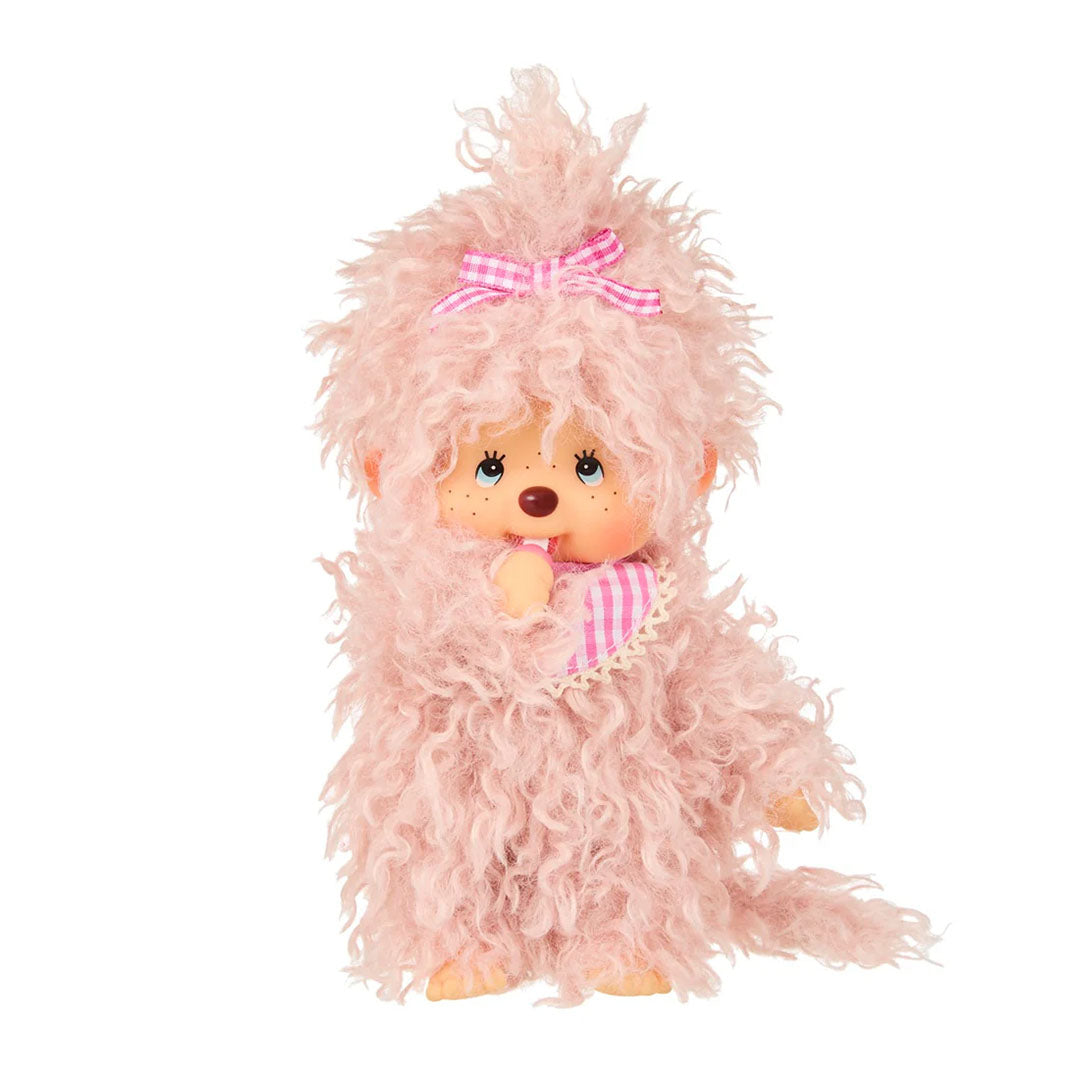 Sekiguchi Monchhichi plush monkey with fluffy pink beige fur, pink gingham bow and bib, thumb in mouth pose.