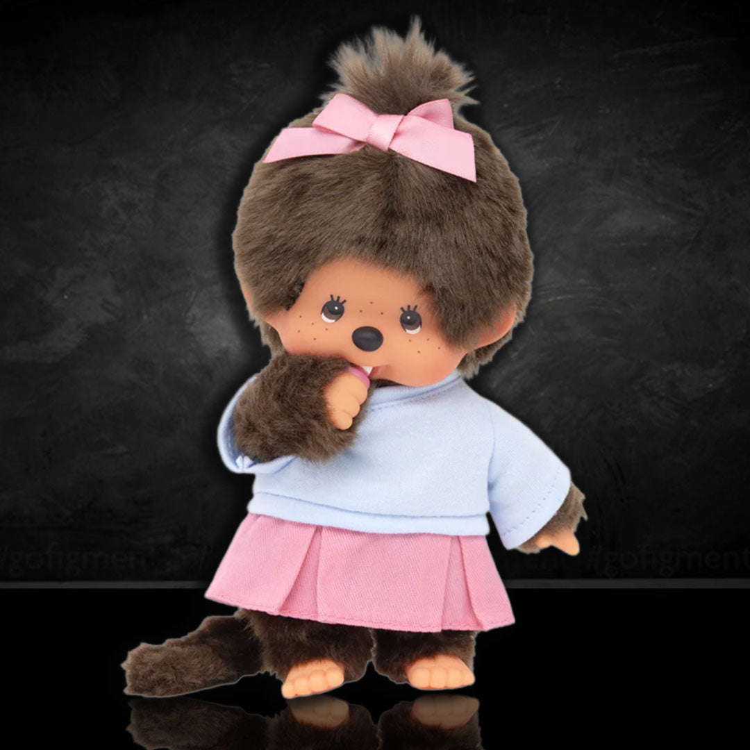 Sekiguchi Monchhichi Girl plush doll in pink skirt and ribbon with blue shirt, soft and collectible 8 inch monkey design.