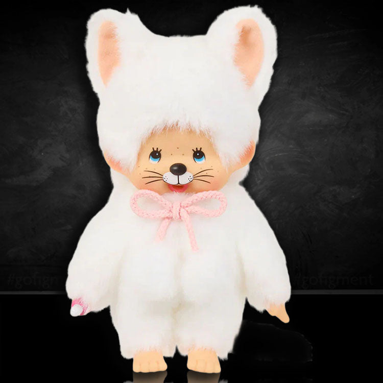Sekiguchi Monchhichi plush wearing a soft white cat costume with pink bow and cute facial features.