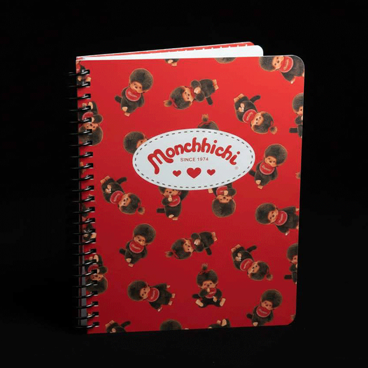 Go Figment Monchhichi red spiral-bound journal featuring multiple kawaii character illustrations and logo since 1974