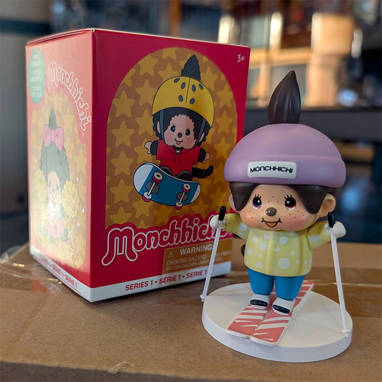Sekiguchi Boy Monchhichi skiing figure with purple helmet on white snow base from Sports Series 1 collectible vinyl