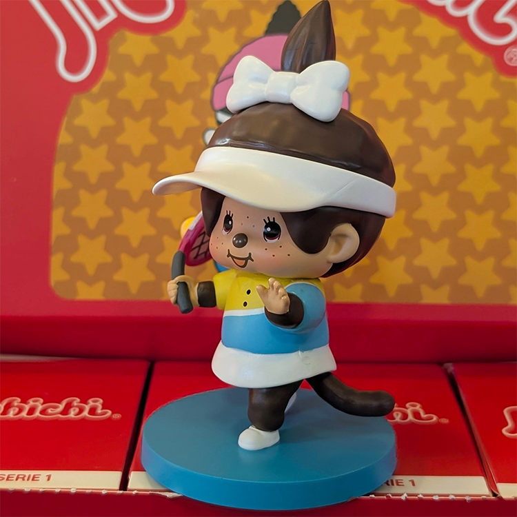 Sekiguchi Monchhichi Girl Tennis Player vinyl figure with white visor mid-swing on blue court base