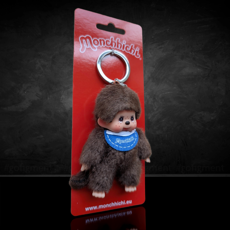 Sekiguchi Monchhichi classic boy keychain with blue bib plush figure on red packaging card