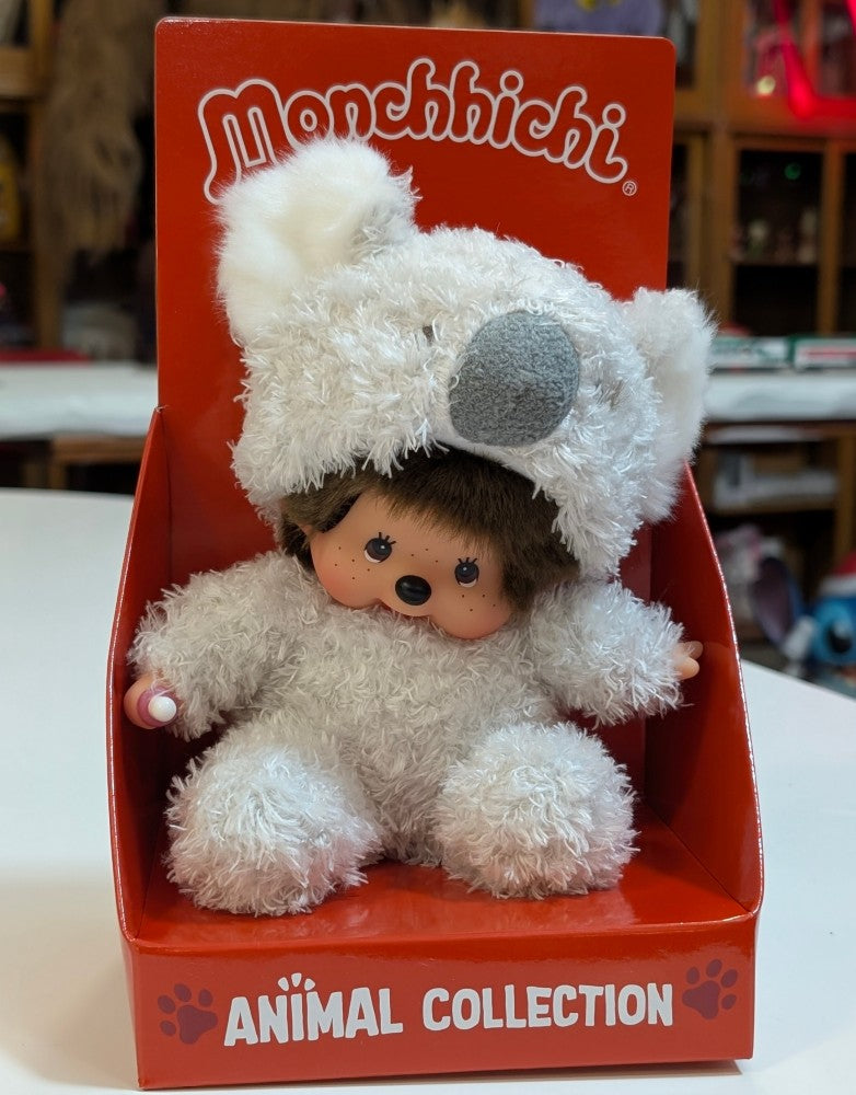 Sekiguchi Monchhichi sitting plush doll dressed in fluffy white koala costume in red animal collection display