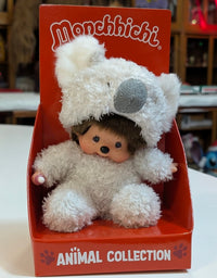 Sekiguchi Monchhichi sitting plush doll dressed in fluffy white koala costume in red animal collection display