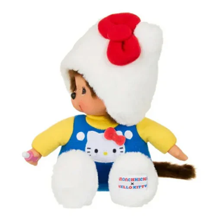 Monchhichi plush wearing a Hello Kitty hood and blue overalls, crafted by Sekiguchi in a limited edition design.