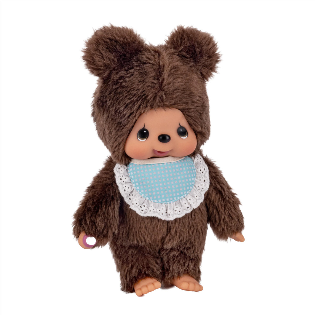 Brown bear plush doll wearing a blue polka-dot bib and white lace collar