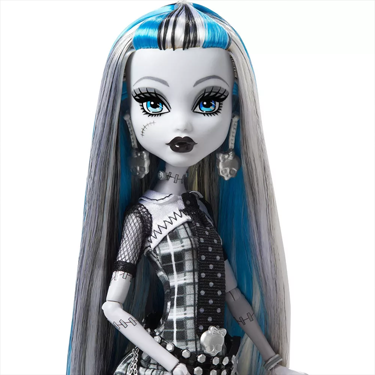Monster High Frankie Stein doll by Mattel with black and white hair, blue highlights, and plaid dress