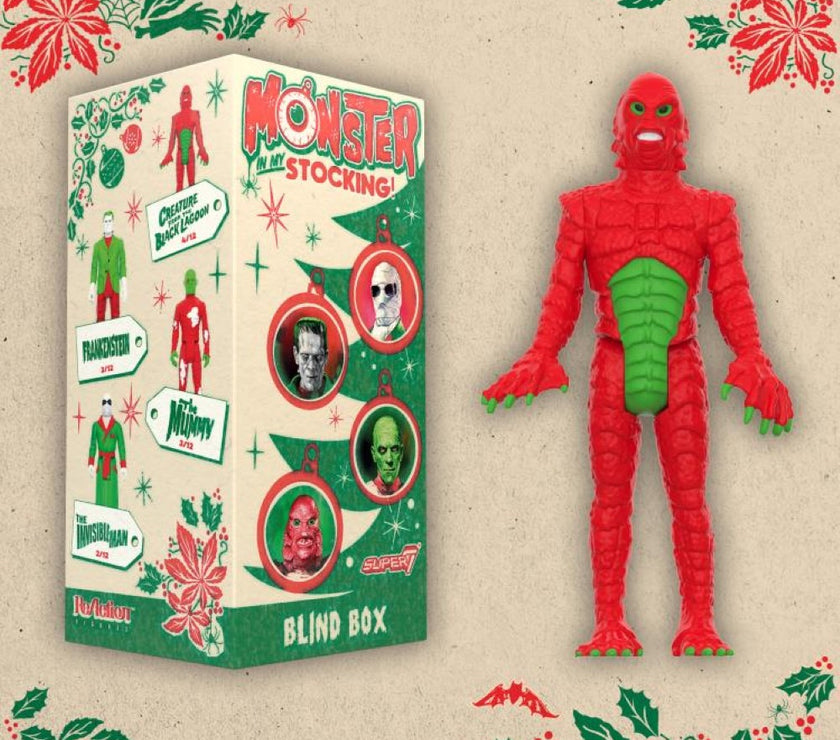 Hasbro Universal Monsters ReAction Monster In My Stocking blind box with red and green creature figure on festive background