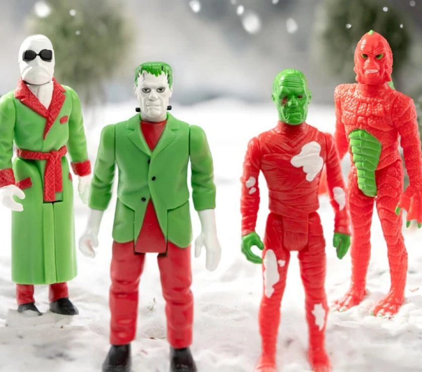 Hasbro Universal Monsters ReAction holiday action figures featuring classic monsters dressed in festive colors.