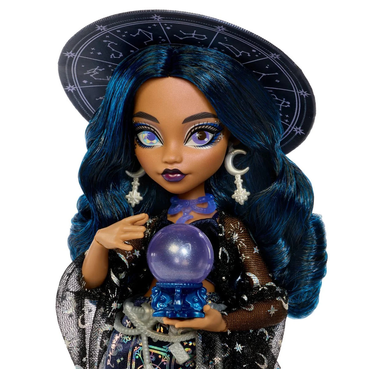 Dark-skinned doll with blue hair, wearing a star-patterned cape and hat, holding a purple crystal ball.