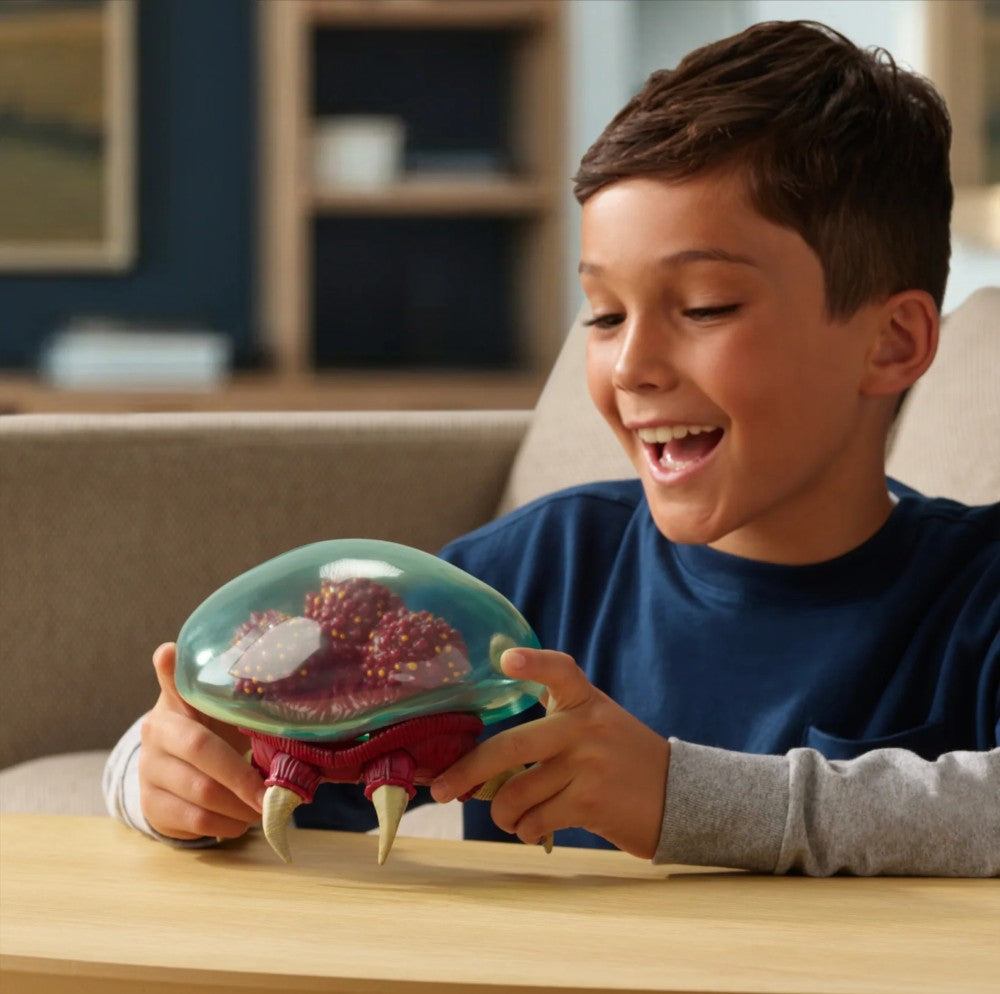 Boy playing with 6 inch Go Figment Metroid Prime figure from World of Nintendo with six points of articulation