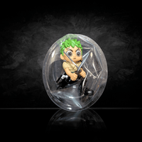 Go Figment One Piece mini figure Zoro with swords inside clear blind box packaging on black background