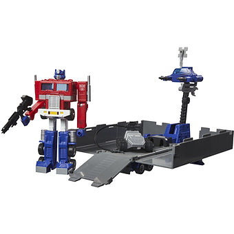 Hasbro Transformers G1 Optimus Prime figure with trailer base and accessories in retro style display