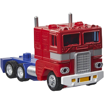 Hasbro Transformers G1 Optimus Prime figure in red and blue semi-truck mode with detailed vintage design.