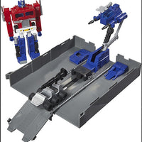 Hasbro Transformers G1 Optimus Prime action figure with trailer battle station and accessories displayed on white background