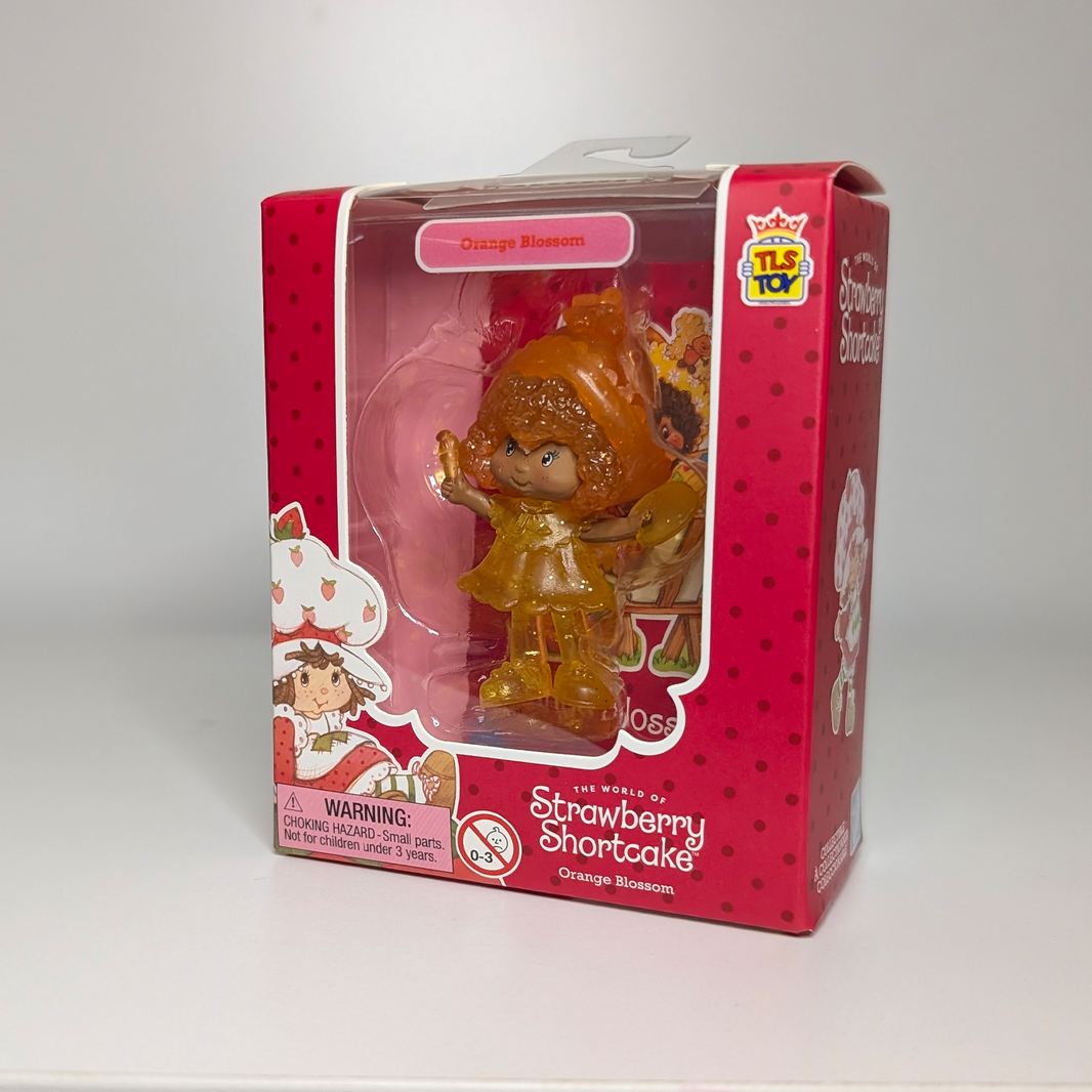 Orange Blossom Translucent 2.5" Strawberry Shortcake Cheebee Figure by Loyal Subjects in original red packaging with Strawberry Shortcake branding