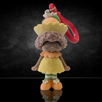 UCC World of Strawberry Shortcake soft flocked mini figure clip wearing yellow dress with orange shoes and red hook attachment