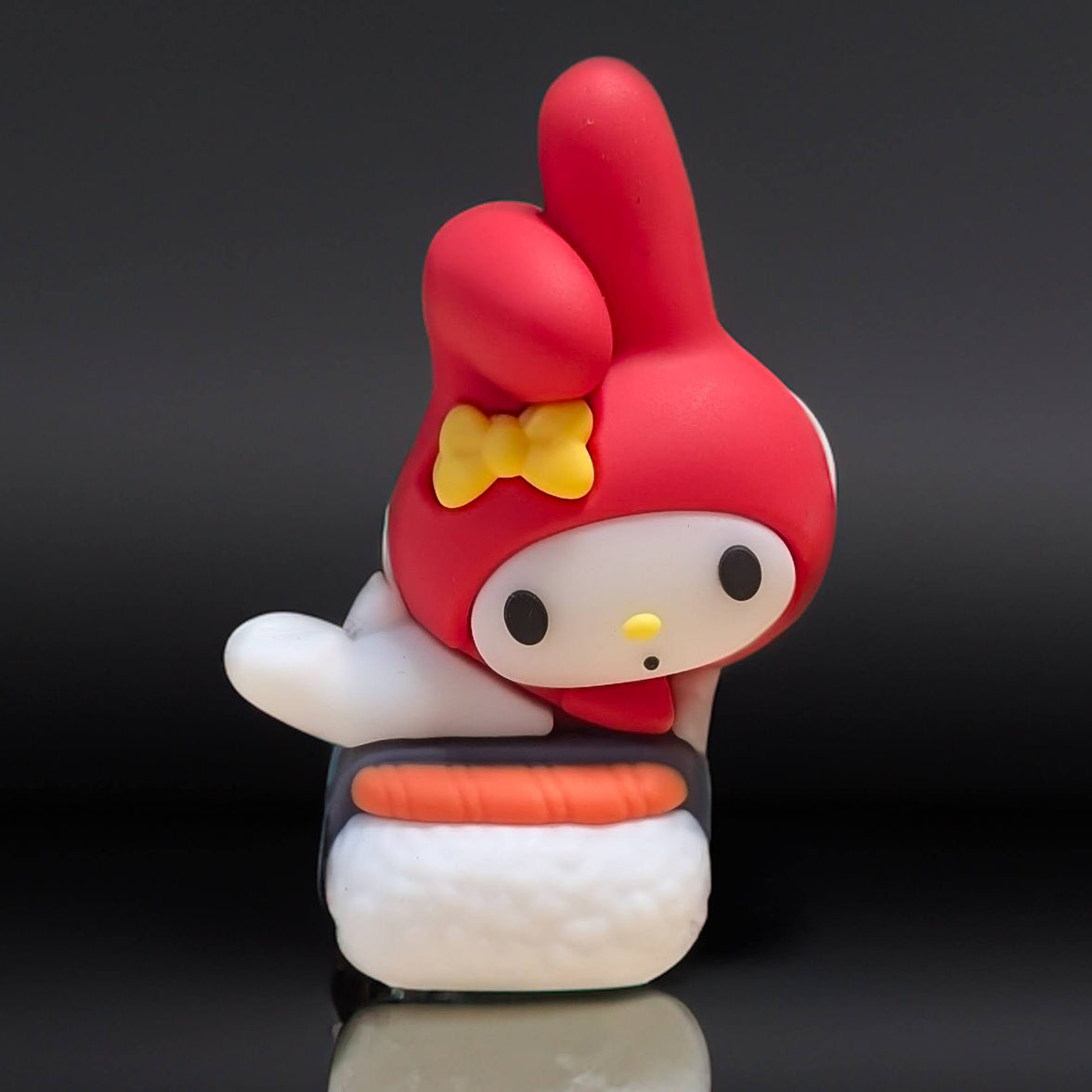 Go Figment Hello Kitty and Friends figure featuring My Melody in red hood with yellow bow on sushi base