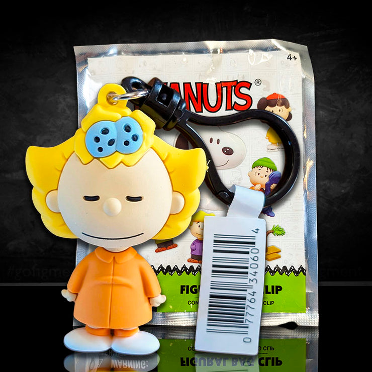 Monogram Peanuts Series 4 Sally Brown figural bag clip in orange outfit with black carabiner clip packaging visible